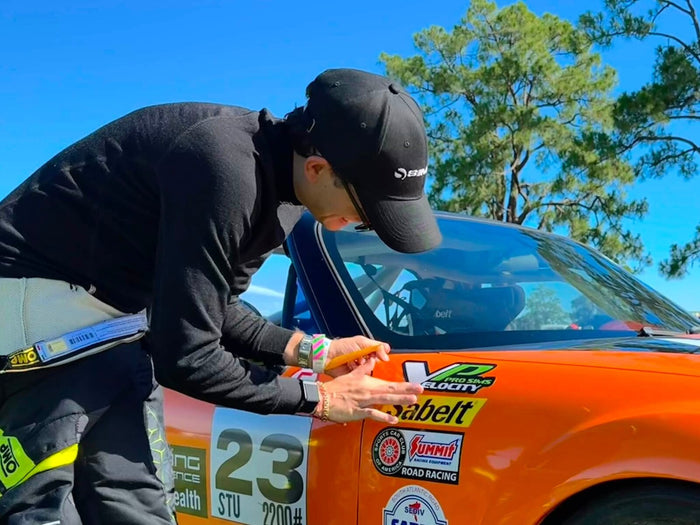 Applying the Velocity Pro Sims decal to the number 23 MX-5